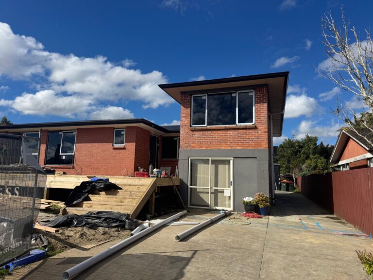 Rear of the Papatoetoe home with the two-storey wing and new timber deck