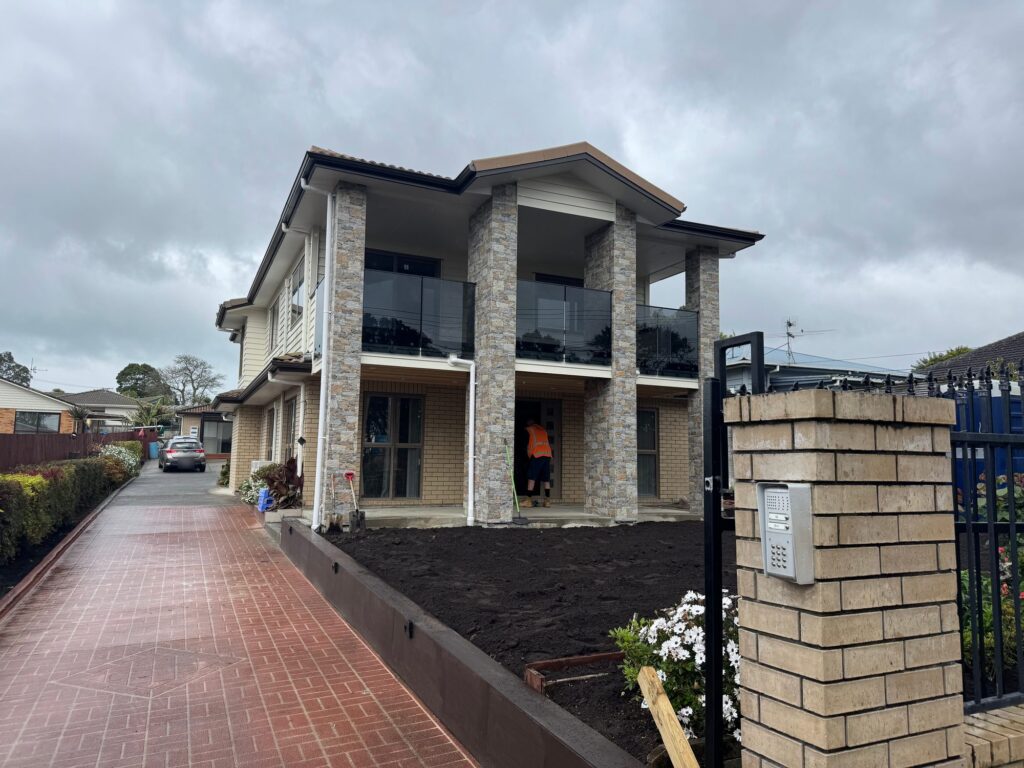 Front of 69 Margan Ave, New Lynn, after the renovation, seen from the driveway gate