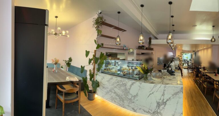 Café fit-out with marble-look counter, pendant lights and timber floor – Mt Eden Road, Auckland